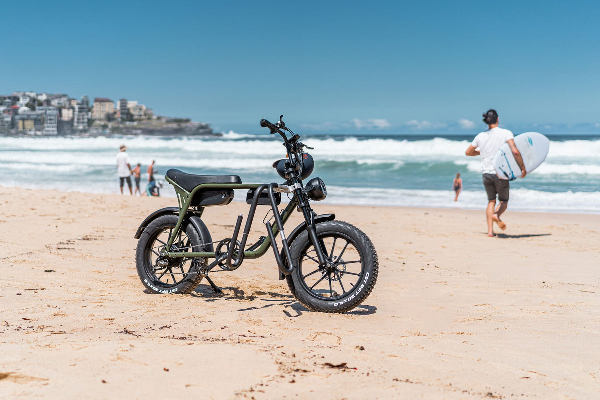 E-bike parked on the beach at sunrise